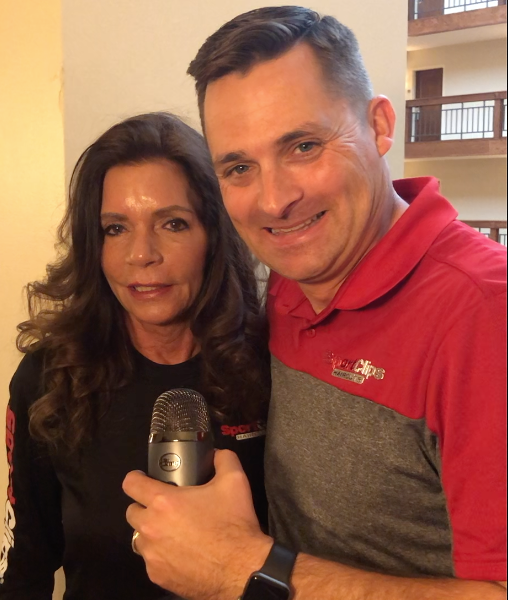 Chad Jordan and Judy Green holding a microphone